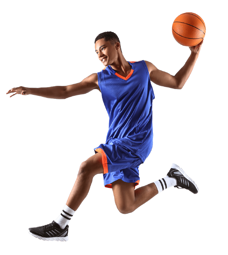 Basketball player in blue uniform leaping with a ball raised in one hand