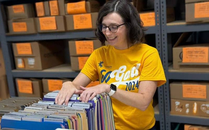 woman paging through files