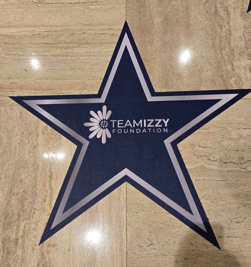 A star on the ground with the words TeamIzzy Foundation inside