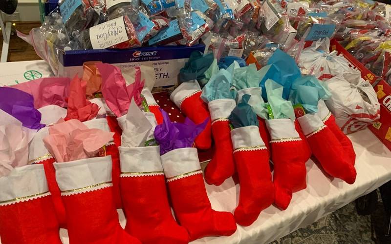 a bunch of filled reds christmas stockings