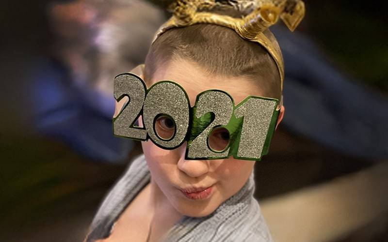 someone wearing a eye mask that say 2021