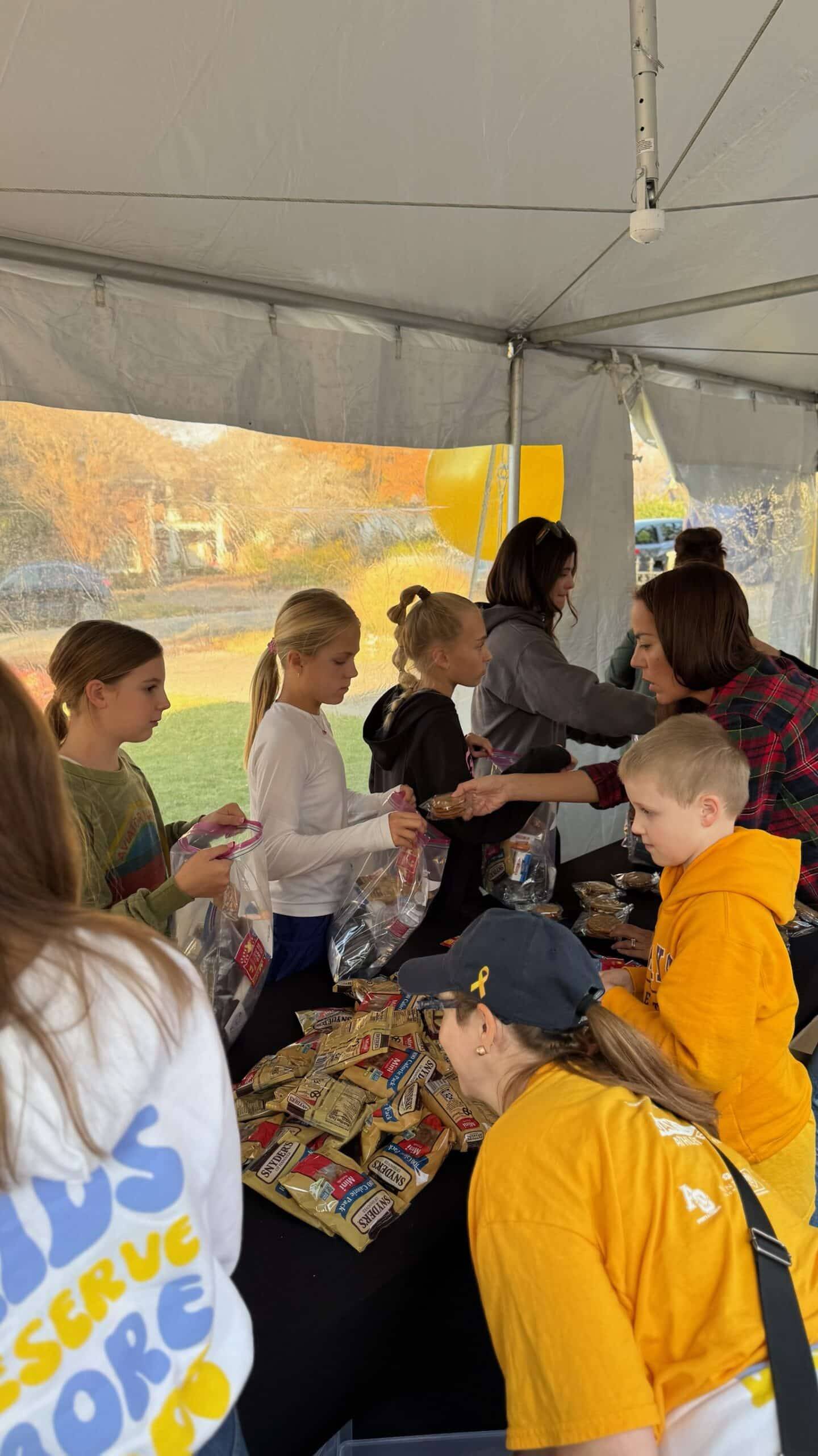 Children under a tent outside