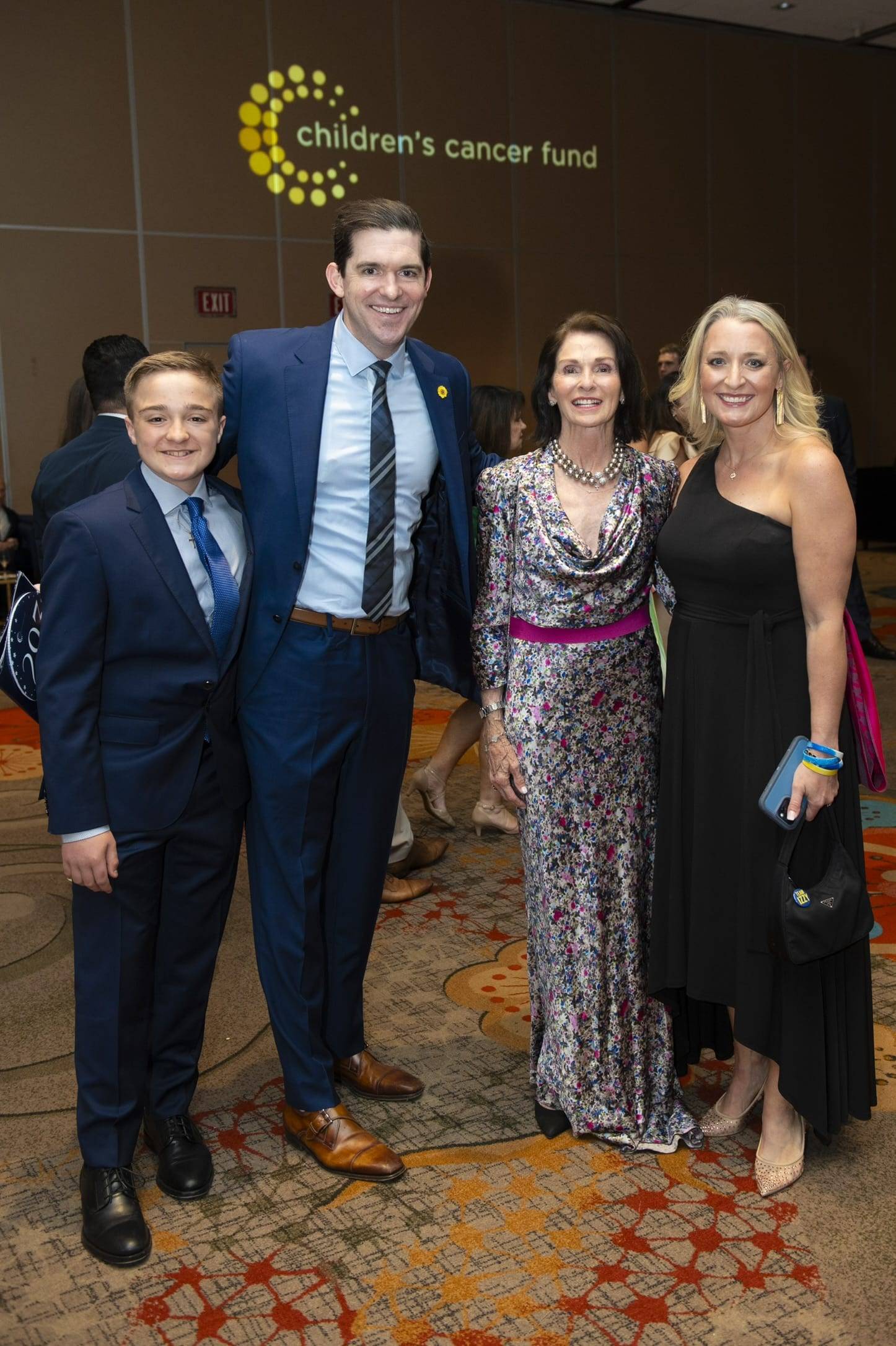 A family standing together at an event
