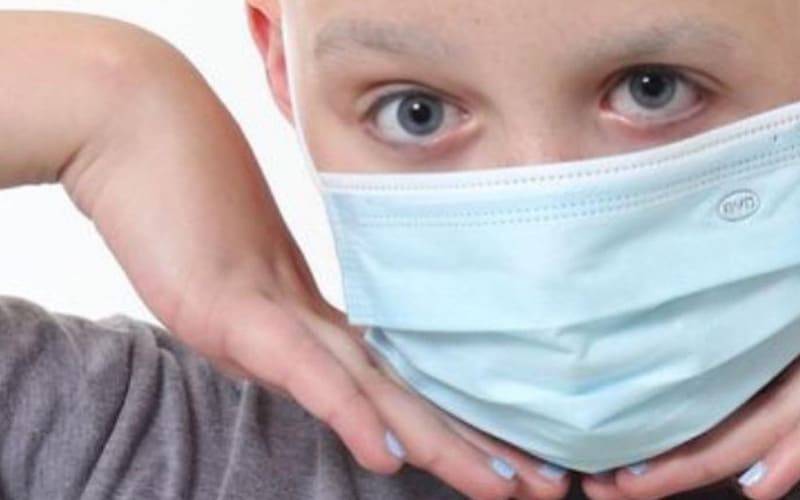 a child in a face mask